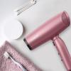 imageConair Hair Dryer with Diffuser and Folding Handle Travel Friendly Hair Dryer Radiance Boost Blow Dryer for Less Frizz More Shine and Irresistibly Silky Hair Includes Diffuser and Concentrator